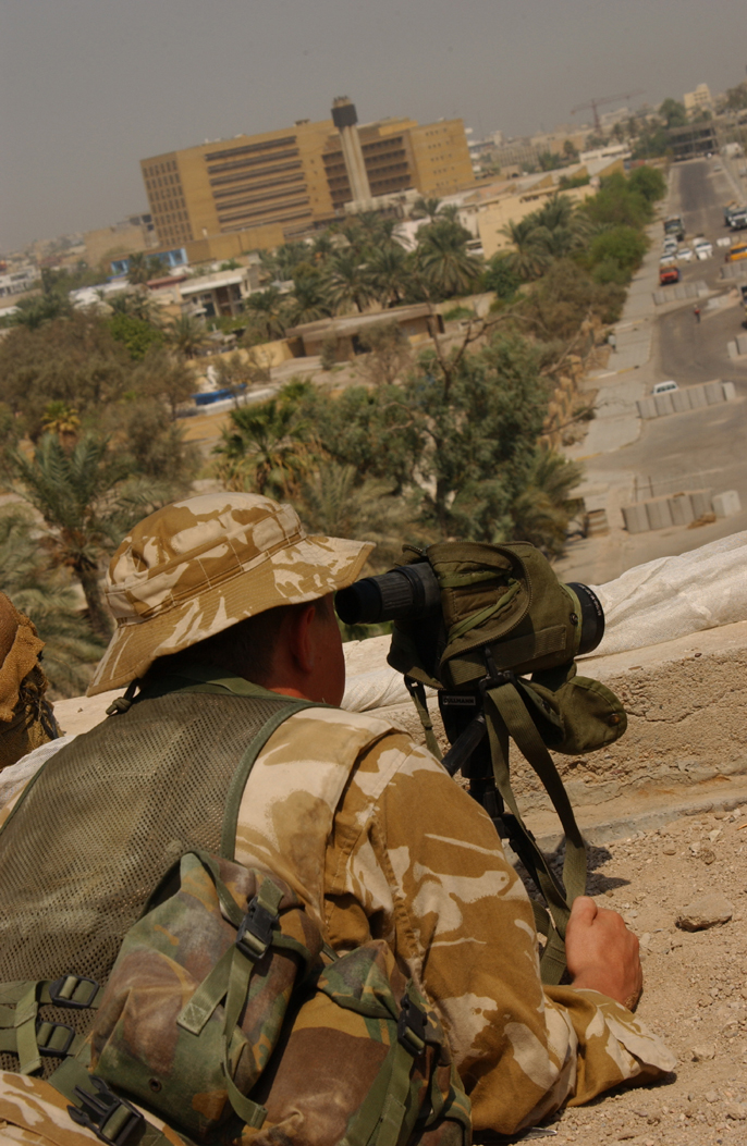 A sniper from Scotland's Black Watch (Royal Highland Regiment) focuses on an area of concern in Basra, Iraq, 8th September 2004. (U.S. Army photo by Staff Sgt. Christopher J. Crawford) 